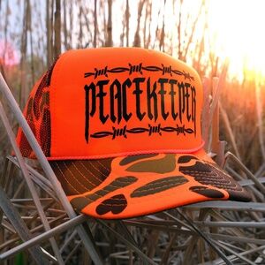 Neon Peacekeeper Camo Trucker Hat